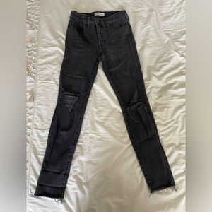 High rise button down skinny black jeans